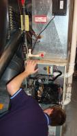 technician working on a furnace Augusta GA