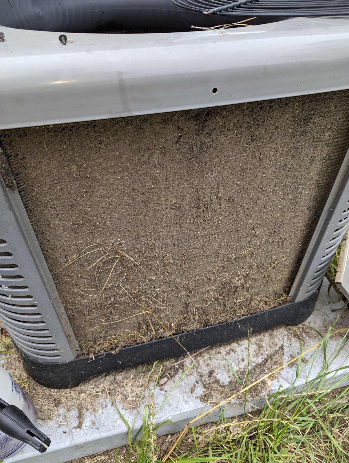 Picture of a heat pump in Augusta that is covered in dust and in need of maintenance